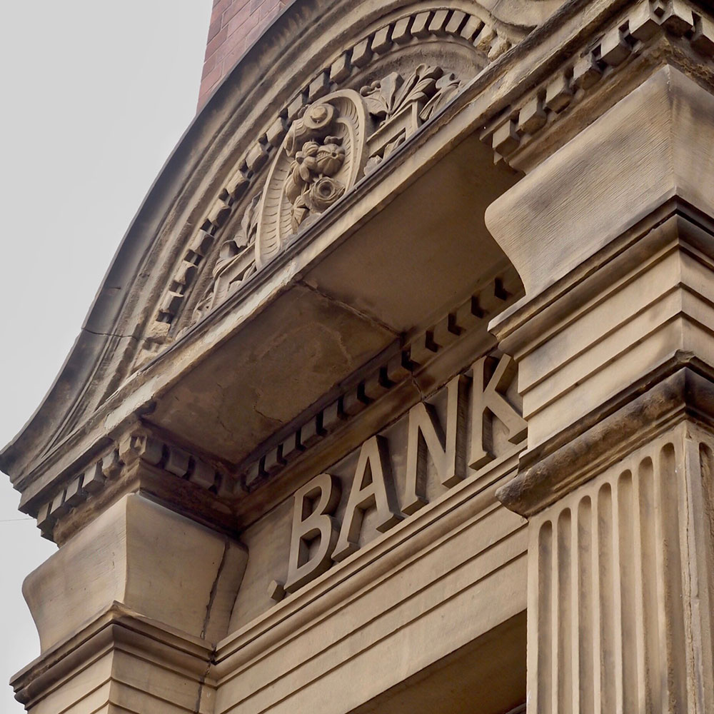 The front of an old bank build with the word 