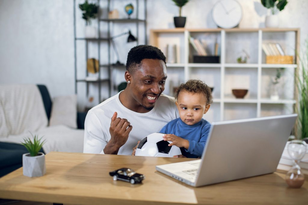 Child and parent at laptop