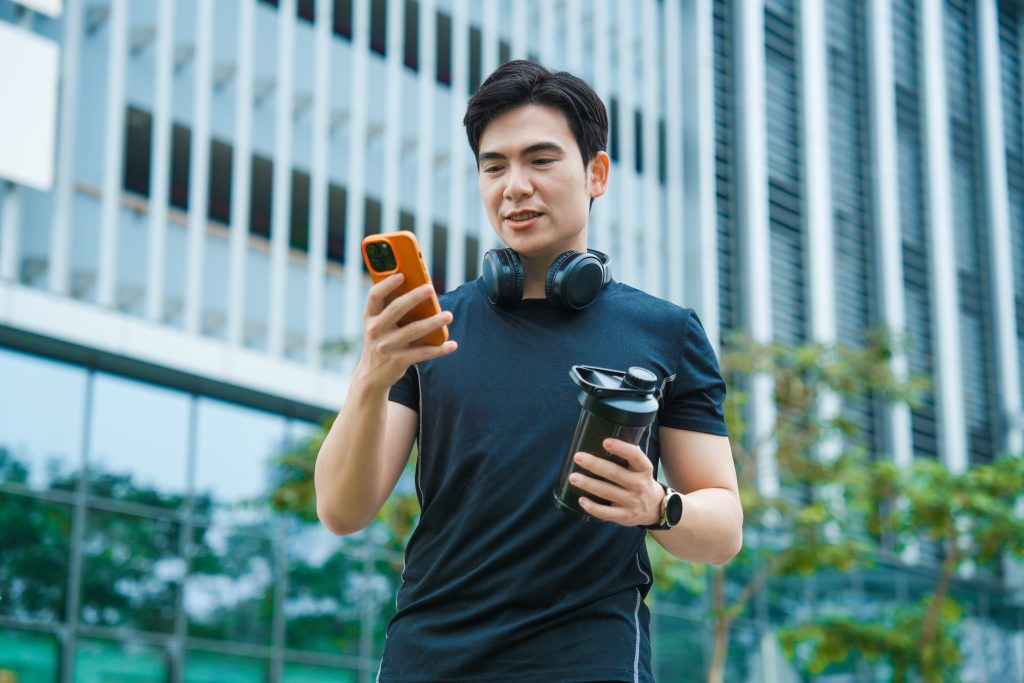 Man checking phone while working out