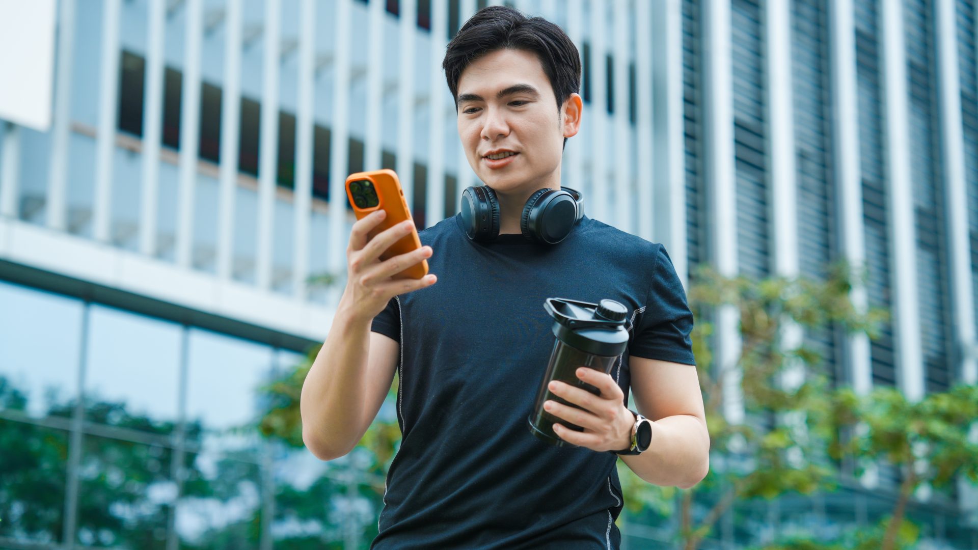 Man checking phone while working out